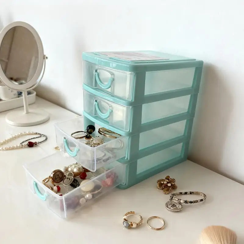 boîte rangement transparente bleu clair moderne niveaux tiroirs poignées bijoux strass domestique