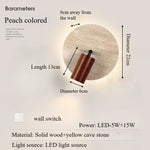 lampe murale moderne pierre jaune texture bois naturel peach beige interrupteur câble minimaliste