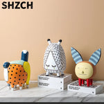figurines decoratives modernes enfants couleurs vives motifs points textures lisses deco maison exposition