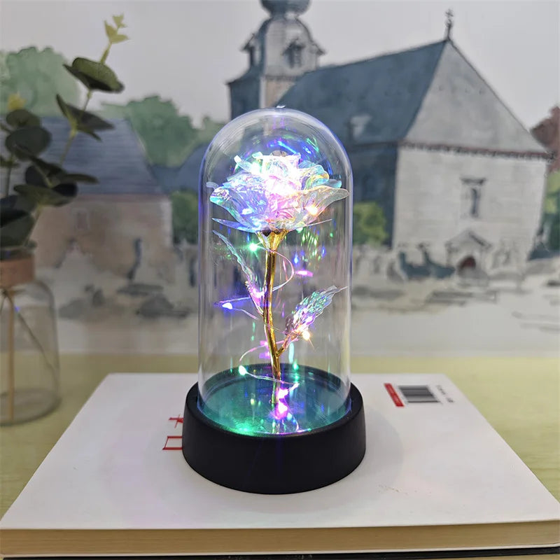 lampe led rose stabilisée dorée feuilles vertes moderne nuit multicolore base noire verre transparent