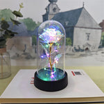 lampe led rose stabilisée dorée feuilles vertes moderne nuit multicolore base noire verre transparent