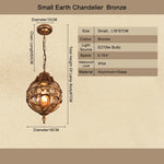 Lampe suspendue artisanale bronze noir ornements géométriques transparente vintage chambre salon