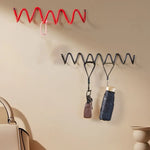 porte sacs spirale moderne rouge noir orange violet fixations murales multifonctionnels