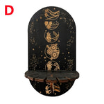 étagère murale noire dorée ornementations astrologiques pendeloques semi précieuses artisanal