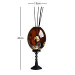 bougie décorative moderne élégante motifs floraux dorés texture ondulée marron clair noir salon diffusion