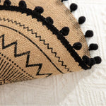 serviettes table boho chic beige noir motifs géométriques franges tissu lin opaques rondes