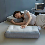 oreiller cervical ergonomique gris blanc texture tissée moderne contour arrondi fixations
