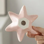 support encens fleur rose pâle doré moderne texture lisse brillante argenté