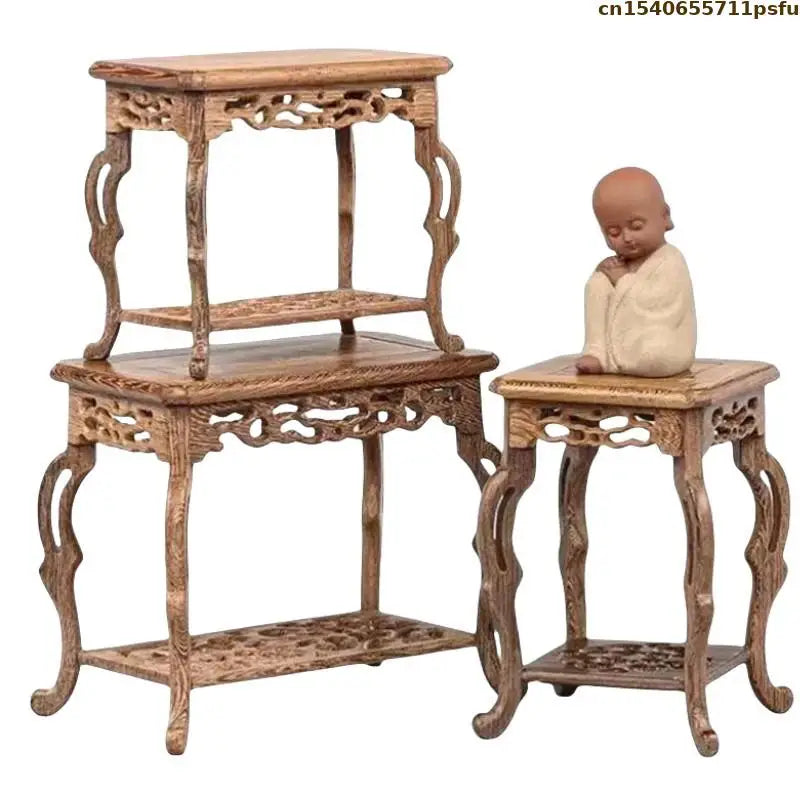 table basse bois rose classique gravures artisanal marron clair pot plante figurine cadre photo