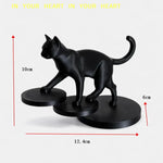 statue chat noir résine lisse contemporaine décoration intérieure base circulaire ornement salon minimaliste