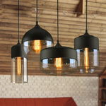 suspension lumineuse moderne pendentif verre noir transparent contemporain fixation câble luminaire salle manger chambre