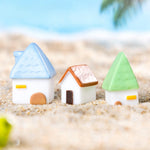 décoration miniatures maison blanc brun bleu vert orange toits vagues minimaliste cartoon like
