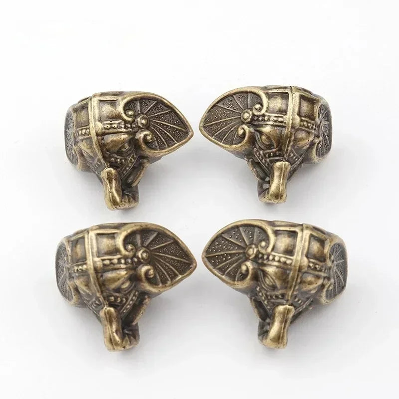 pieds éléphants décoratifs coffres bois tissu osier motifs asiatiques antique bronze doré rouges marrons