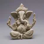 statue ganesha résine sculptée décorative religieuse éléphant fleurs blanches maison
