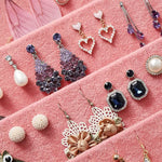 présentoir bijoux velours rose gris classique élégant boîte transparente couvercle boucles oreilles colliers bagues