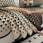 Cette image montre un motif de points de différentes tailles et de différentes couleurs, formant un design géométrique intéressant sur un textile.