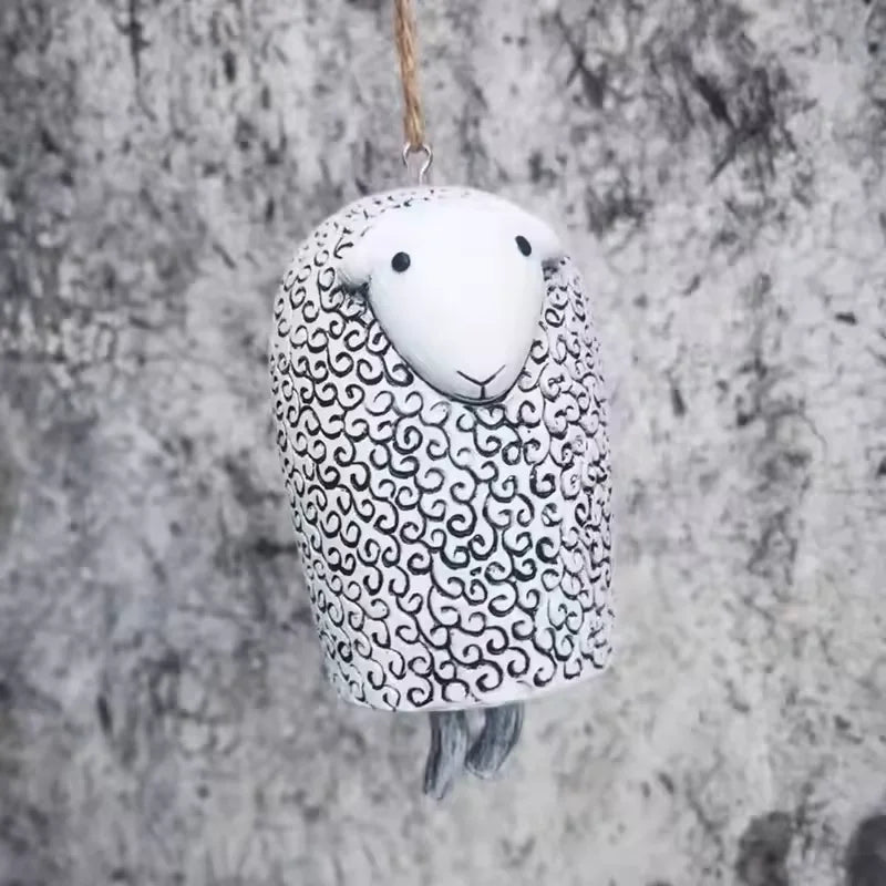 cloches décoratives animaux ours renard hibou motifs poils plumes artisanal extérieur