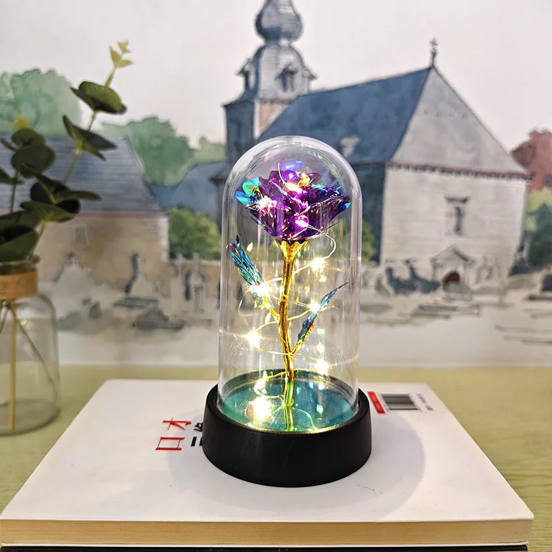 lampe led rose stabilisée dorée feuilles vertes moderne nuit multicolore base noire verre transparent