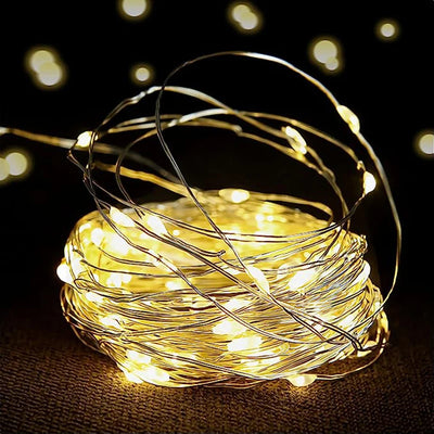 guirlande lumineuse flexible led jaunes vases fleurs séchées papier kraft maquette bateau cheval bascule