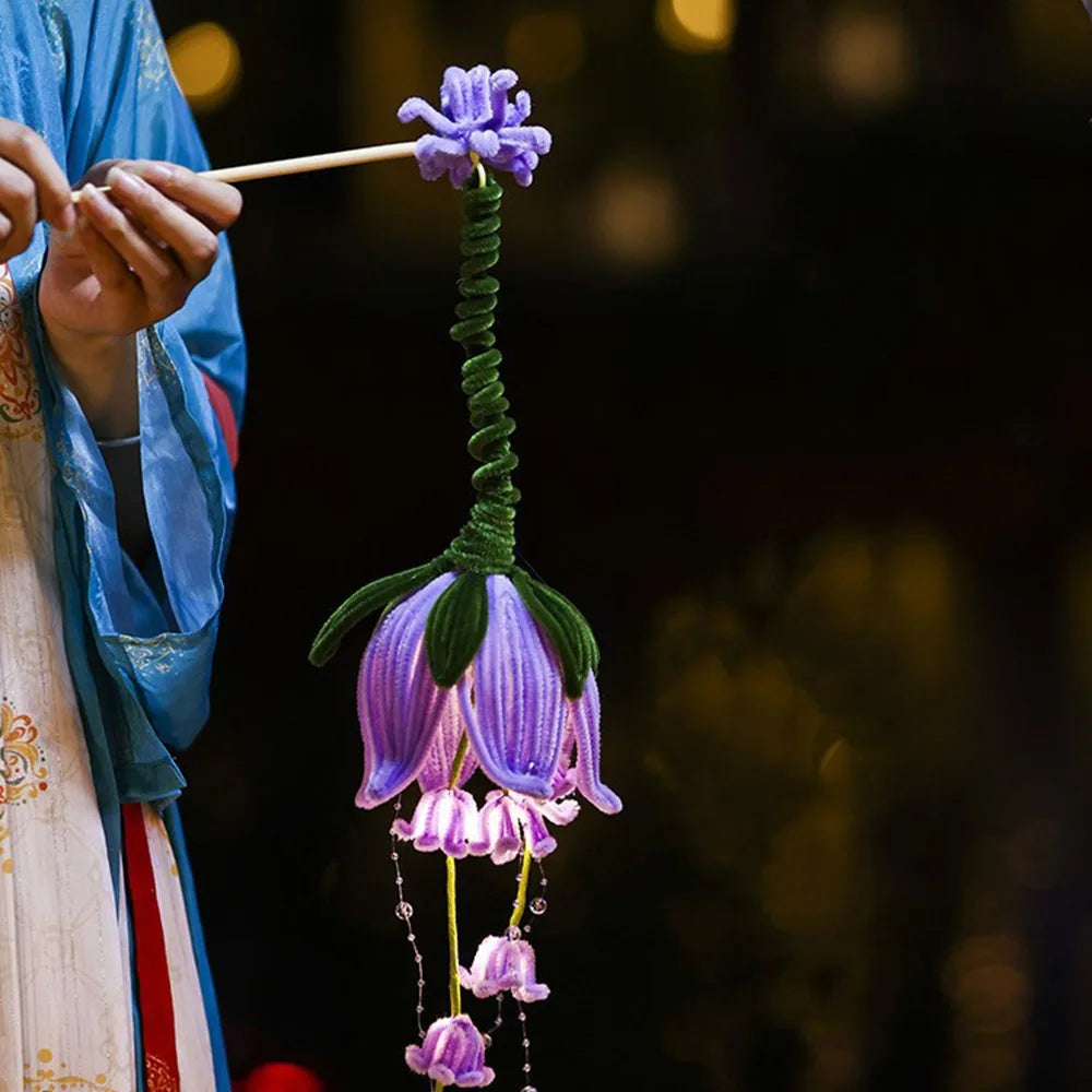 fleur artificielle lumineuse rose blanche bleue violette jaune feuilles fines nervures centre lumineux poignée