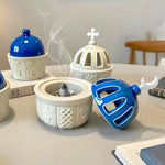 diffuseur huiles essentielles silicone blanc bleu vert motifs géométriques fenêtres modernes