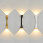 applique murale led or noir blanc moderne forme courbe contemporaine éclairage quotidien fixée mur