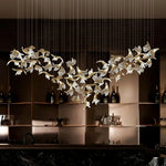 suspension lumineuse moderne élégante dorée feuilles stylisées transparente 120cm 170cm 200cm lumière chaude 3000k