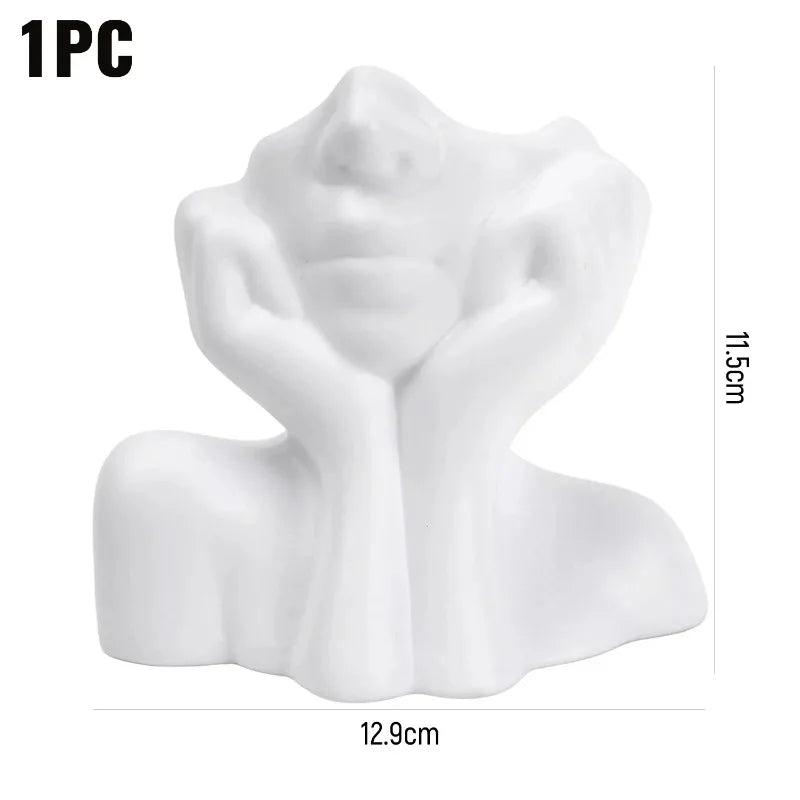 support pinceaux maquillage or argent noir visage stylisé moderne sculpturaliaux pinceaux