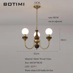 lustres modernes chandelier or marron foncé ampoules led globes opaques éléments décoratifs