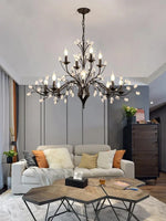 chandelier noir moderne cristaux transparents ampoules blanc chaud suspension élégante branches floralesstylisées