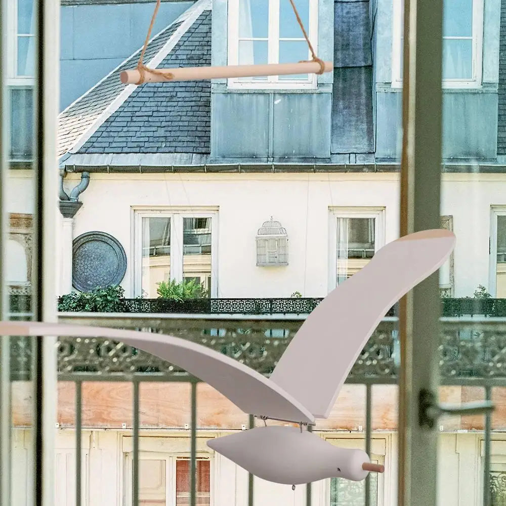 mobile oiseau blanc suspendu cordelettes minimaliste intérieur élégant deco bois naturel scandinave