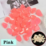 pierres fluorescentes bleu vert jaune rose modernes lisses jardin patio décor lumineux