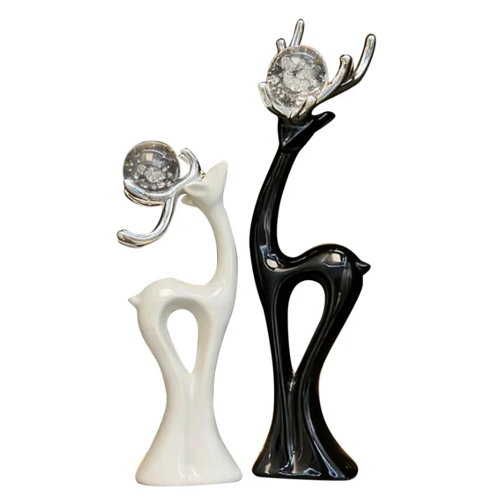 statues cerfs noir blanc sphères verre argentées décoration moderne salon meuble tv armoire vin