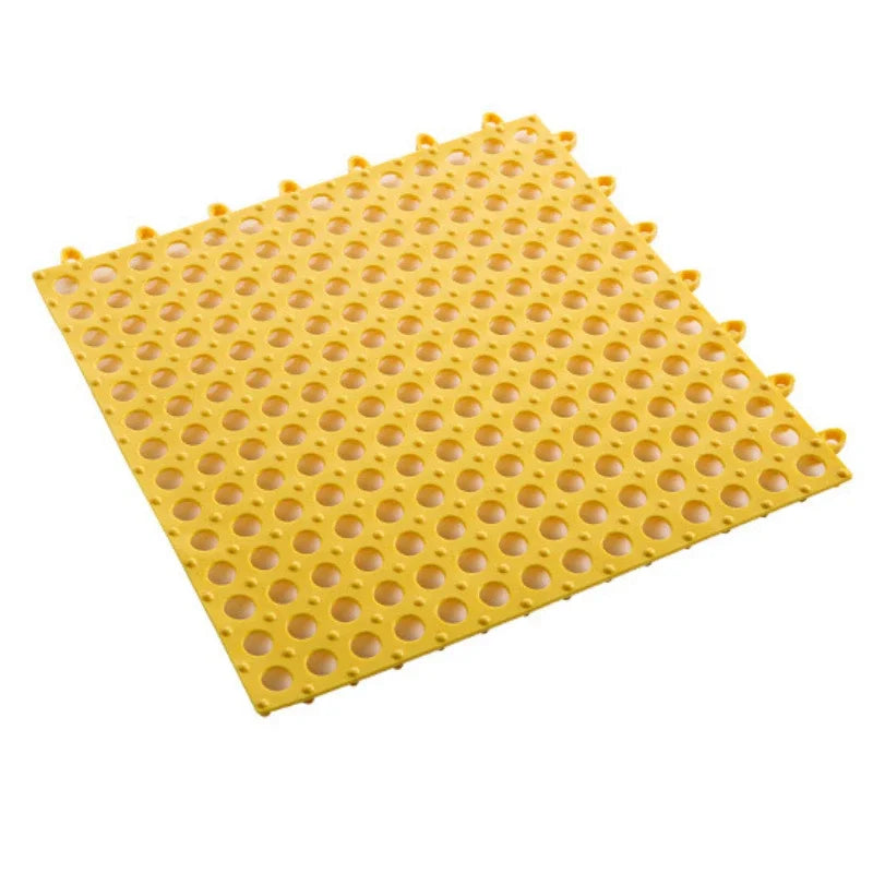 tapis salle bain modulable perforations texturées moderne jaune vert gris fixations noires éléments