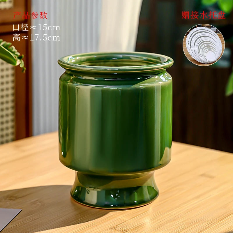 Un beau pot de fleurs en céramique de couleur verte, doté d'un design élégant et moderne, offrant un look rafraîchissant et naturel pour embellir votre intérieur.