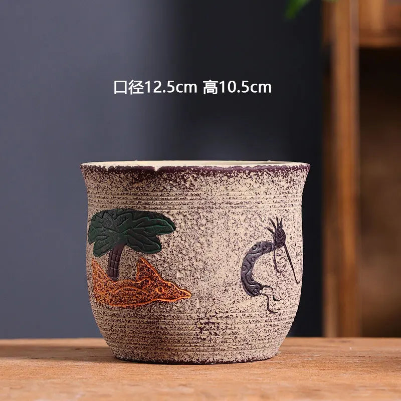 cache pot céramique artisanal méditerranéen couleurs vives motifs texturés plante verte intérieur moderne
