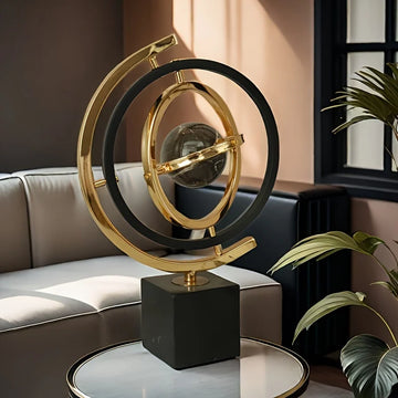 sphère artificielle moderne marbrée dorée noire décoration intérieure base carrée geometrique
