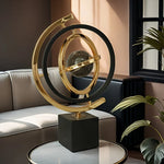 sphère artificielle moderne marbrée dorée noire décoration intérieure base carrée geometrique
