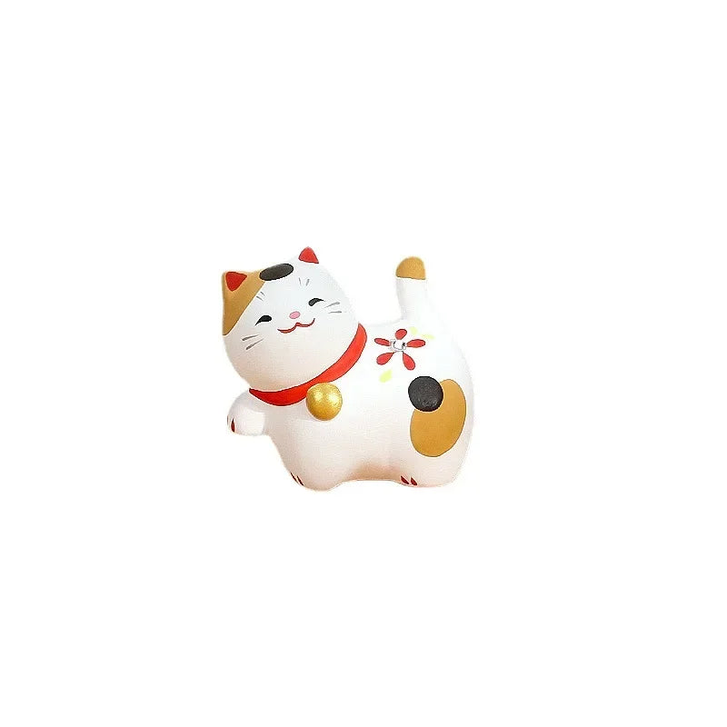 statuette chat céramique artisanale fleurs pois rubans couleurs vives décoration intérieure traditionnelle japonaise anniversaire