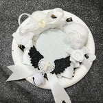 couronne baptême ailes rubans pompons croix dentelle blanche rose violet bleu jaune