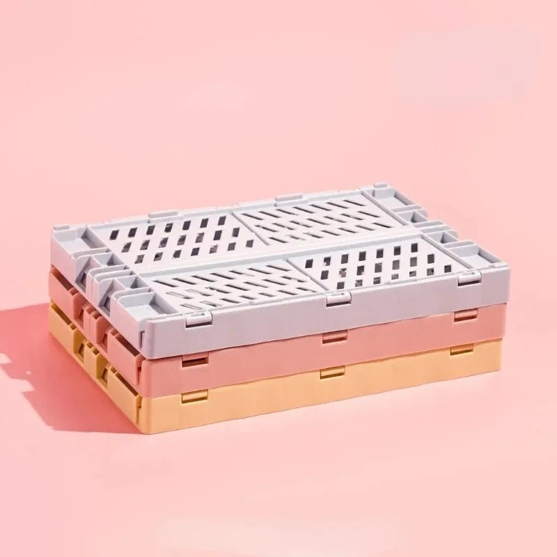 caisse rangement pliable plastique gris vert rose beige blanc grille ventilation moderne minimaliste poignées