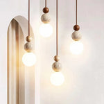 Suspension lumineuse moderne pierre gris beige brun clair texture granulée câble noir salon chambrehôtel