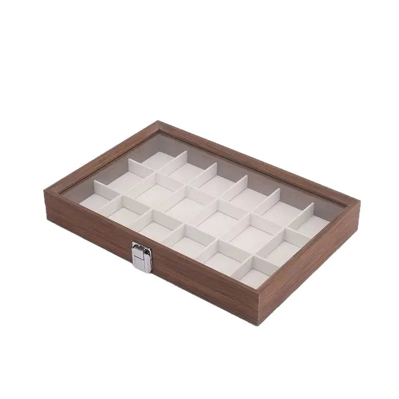 boîte bijoux contemporaine transparente compartiments blancs texture bois poignée métallique minimaliste organisation trousse toilette