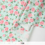 tissu mousseline polyester imprimé fleurs roses fond noir couture robe chemisier rideau diy