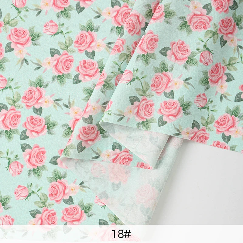 tissu mousseline polyester imprimé fleurs roses fond noir couture robe chemisier rideau diy