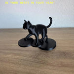 statue chat noir résine lisse contemporaine décoration intérieure base circulaire ornement salon minimaliste