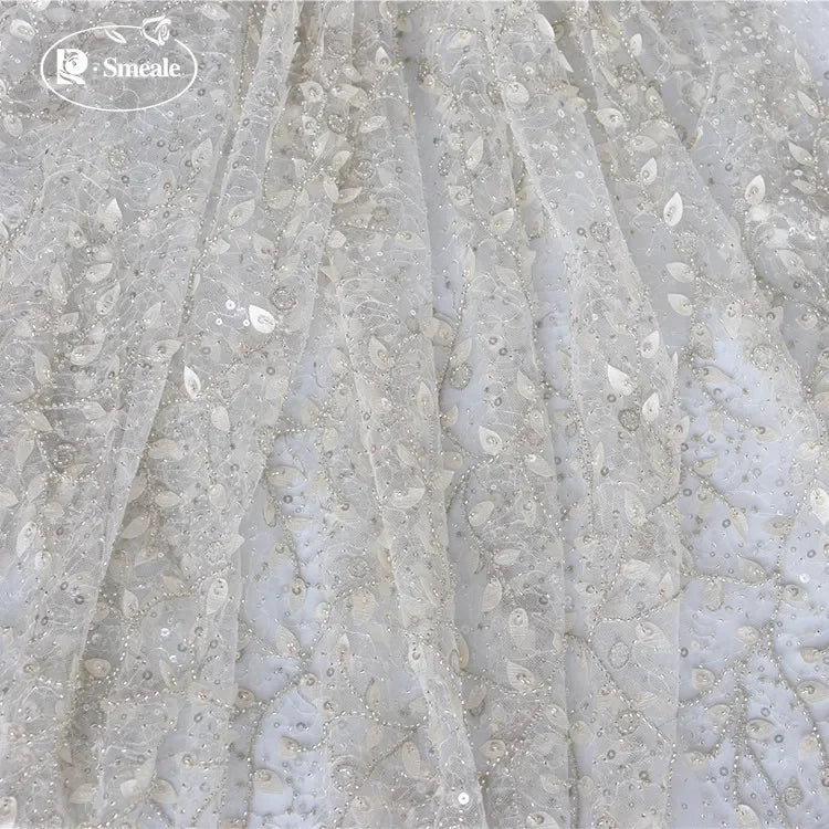 tissu dentelle feuilles brodé élégant polyester translucide blanc argent materiaux couture robes mariage