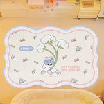 Tapis décoratif enfant avec dessin d'un lapin mignon et de fleurs dans un style illustratif, avec le texte "Butterful have good day" en anglais.