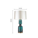 lampe table verre bleu turquoise moderne abat jour opaque pied doré élégante contemporaine led