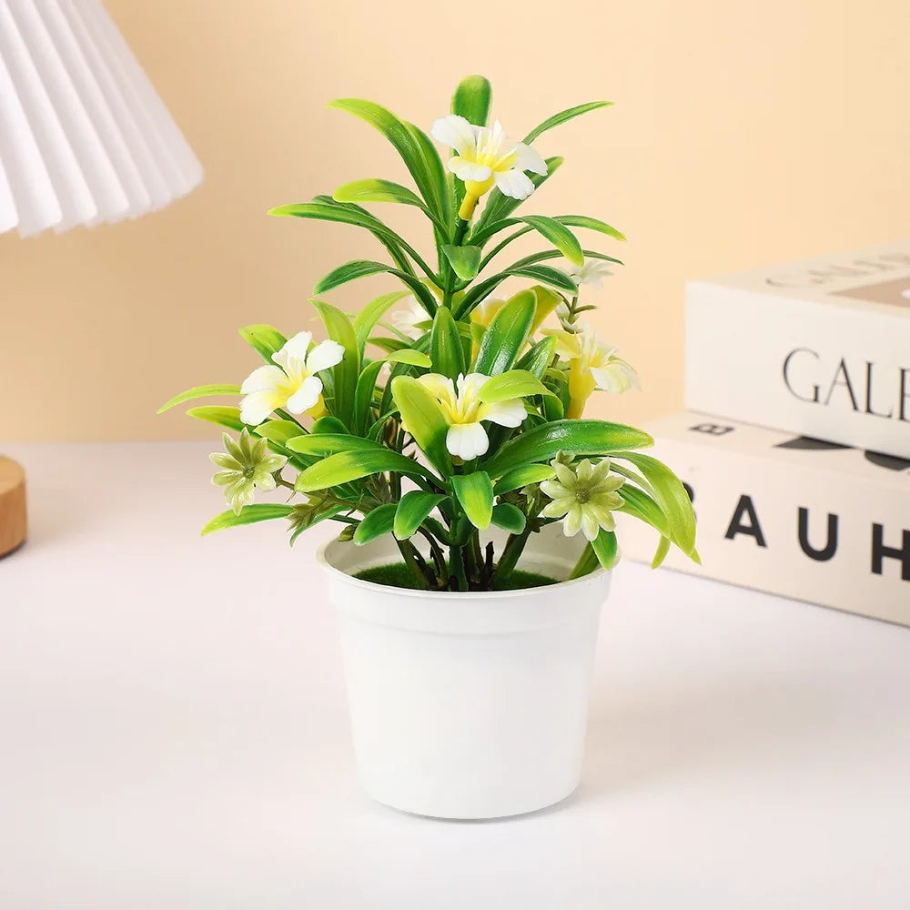 plantes artificielles modernes feuilles vertes fleurs jaunes oranges violettes pot blanc